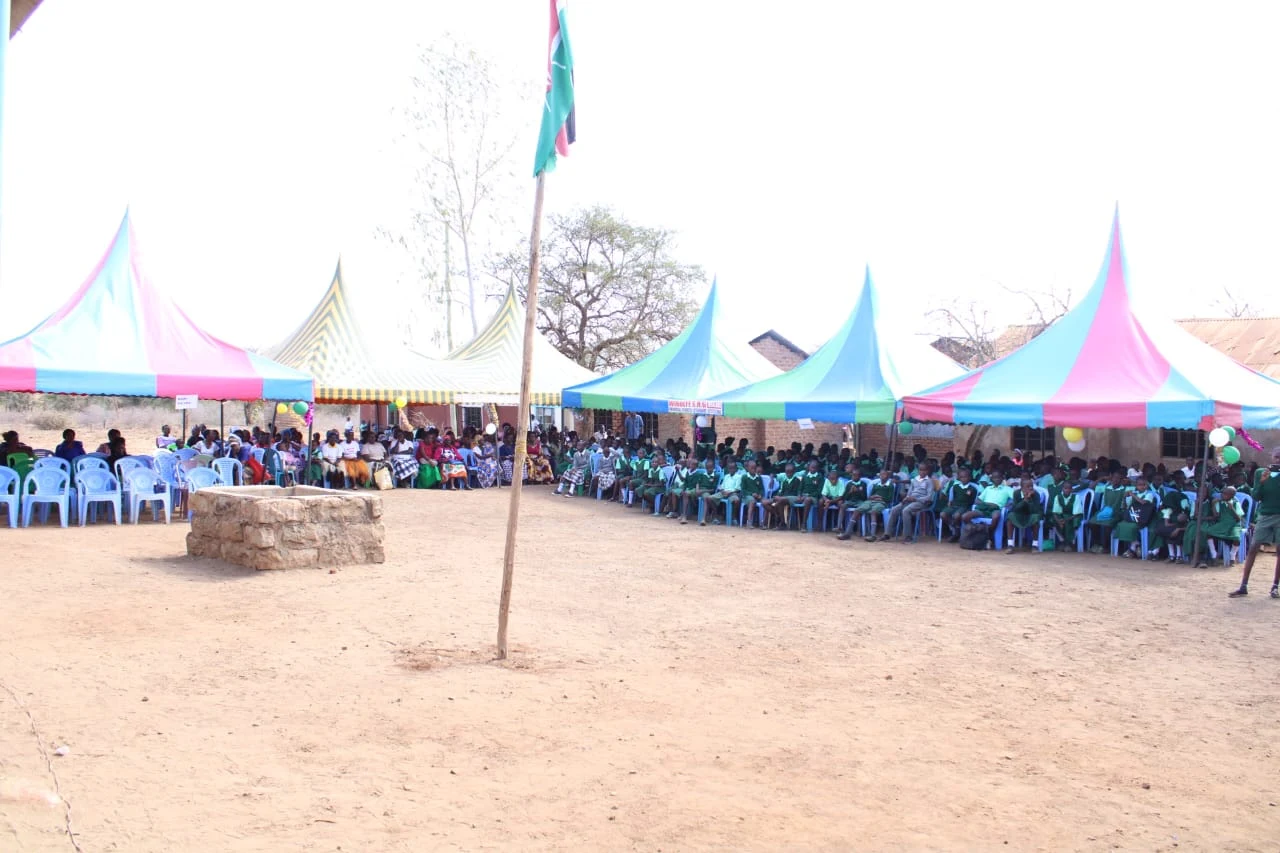Community members and pupils gathered in the Ndalani school courtyard